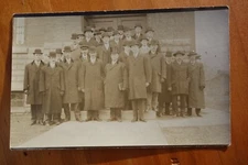 group of distinguished men in long coats and hats, business? real photo rppc