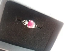 Lady's ring, stamped 10kt white gold -burma ruby with diamond on both side