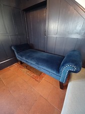 Decorative bench seat in dark navy velvet, silver nailhead detail, wood legs