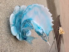 hand made sword fish made of blue sea glass and is a work of art