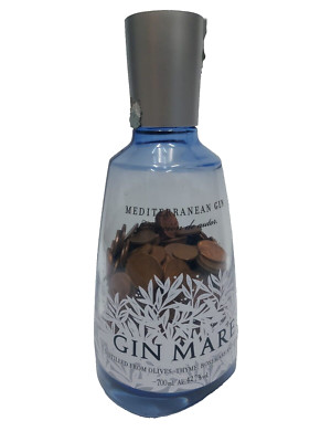 Gin Mare Bottle with coins from 5 and 1 cent. Euro collection