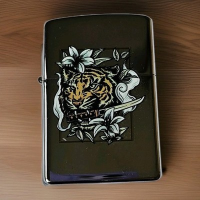 Black Windproof Metal Lighter.  Featuring A Sabretooth Tiger Design.