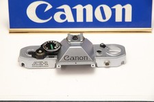 210958 Canon AE-1 Program Chrome Top Cover Repair Part Used.