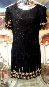 black and gold knee length dress