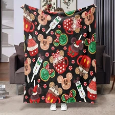 1 plush flannel blanket - decorated with gingerbread men and candy canes