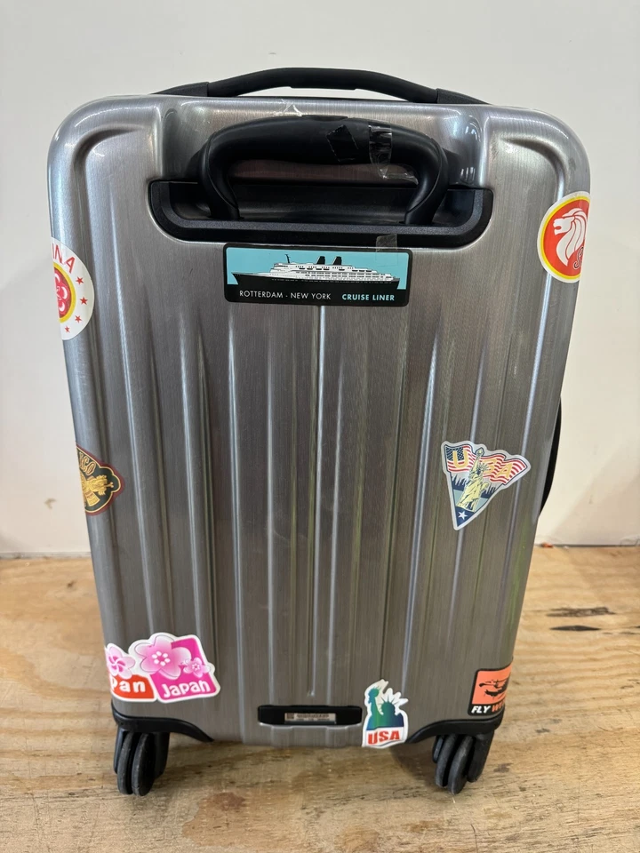 Maleta de equipaje de mano giratoria expandible 22 pulgadas colección TUMI V4 LEER Foto 2 de 4