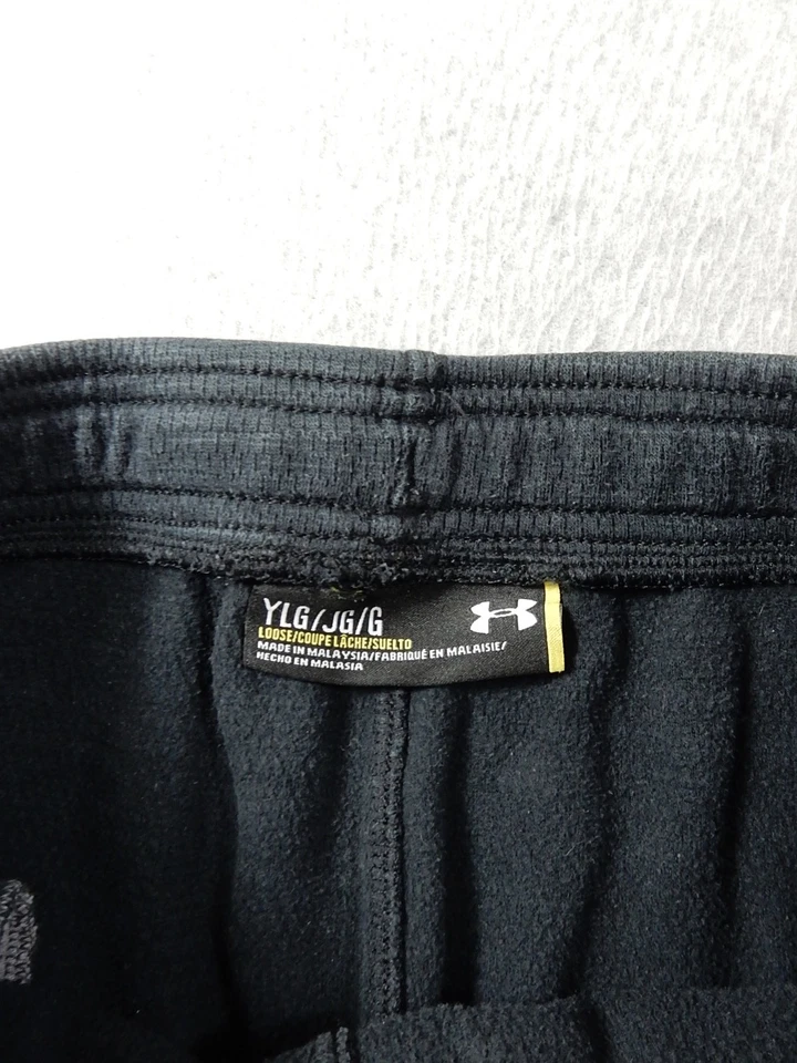 Pantalones de entrenamiento de rendimiento Under Armor holgados (grandes juveniles) negros descoloridos Foto 3 de 4