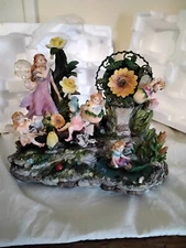 Fairy Sculpture,Musical Animated w/Sunflower carousel that moves w/the music