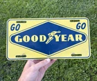 Vintage Goodyear booster license plate gas and oil advertising