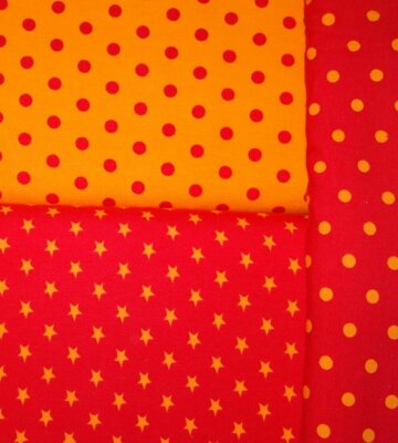 Jersey Sterne Punkte orange rot farbig Baumwolljersey Meterware