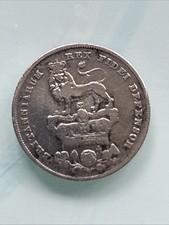 An 1826 shilling, a silver coin from King George IV