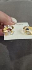 Tory Burch Miller Stud Enamel Hoop Earrings feature a white enamel inlay set