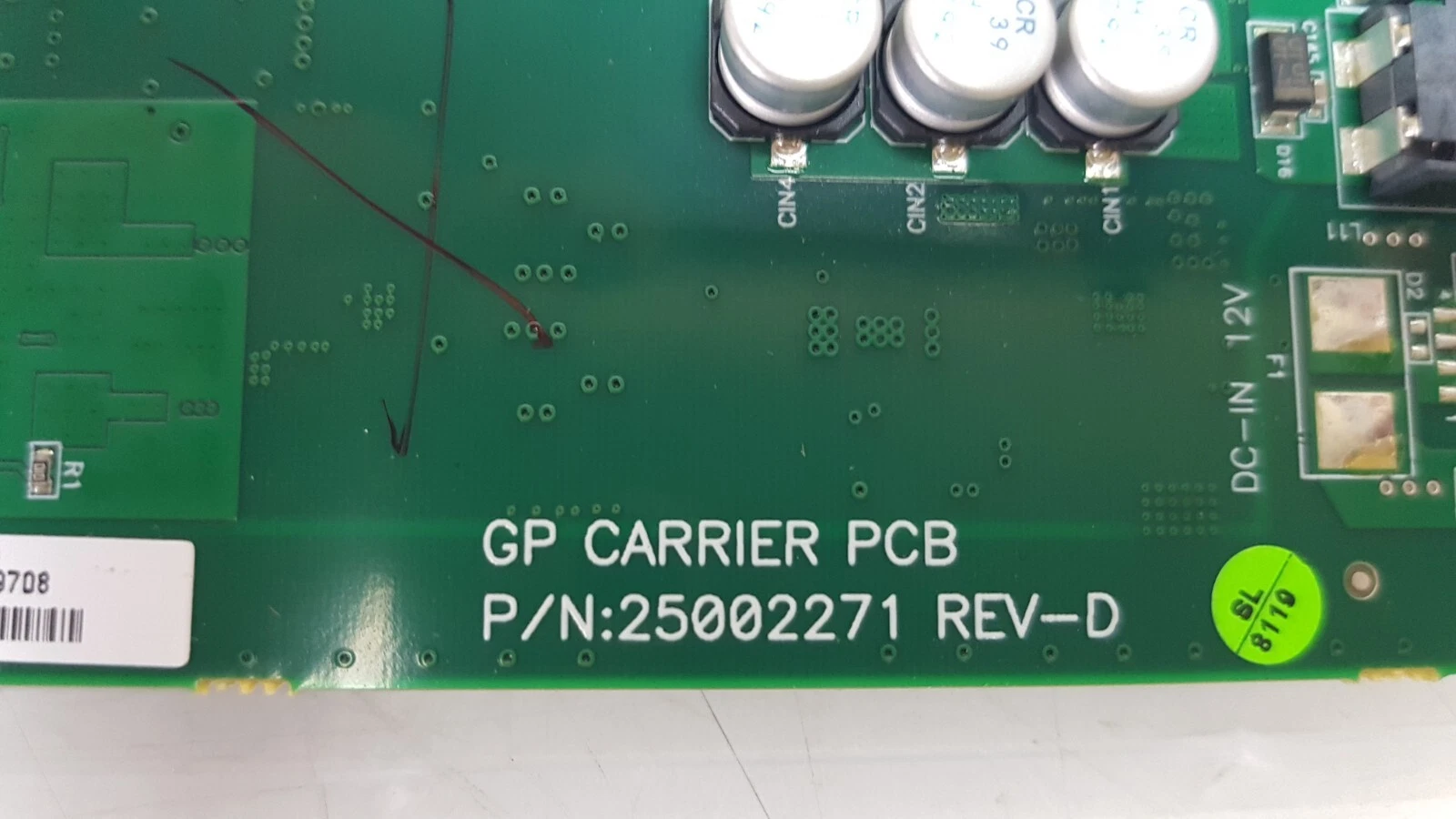 Silkscreen GP CARRIER PCB P/N:25002271 REV-D next to the DC-IN 12V input