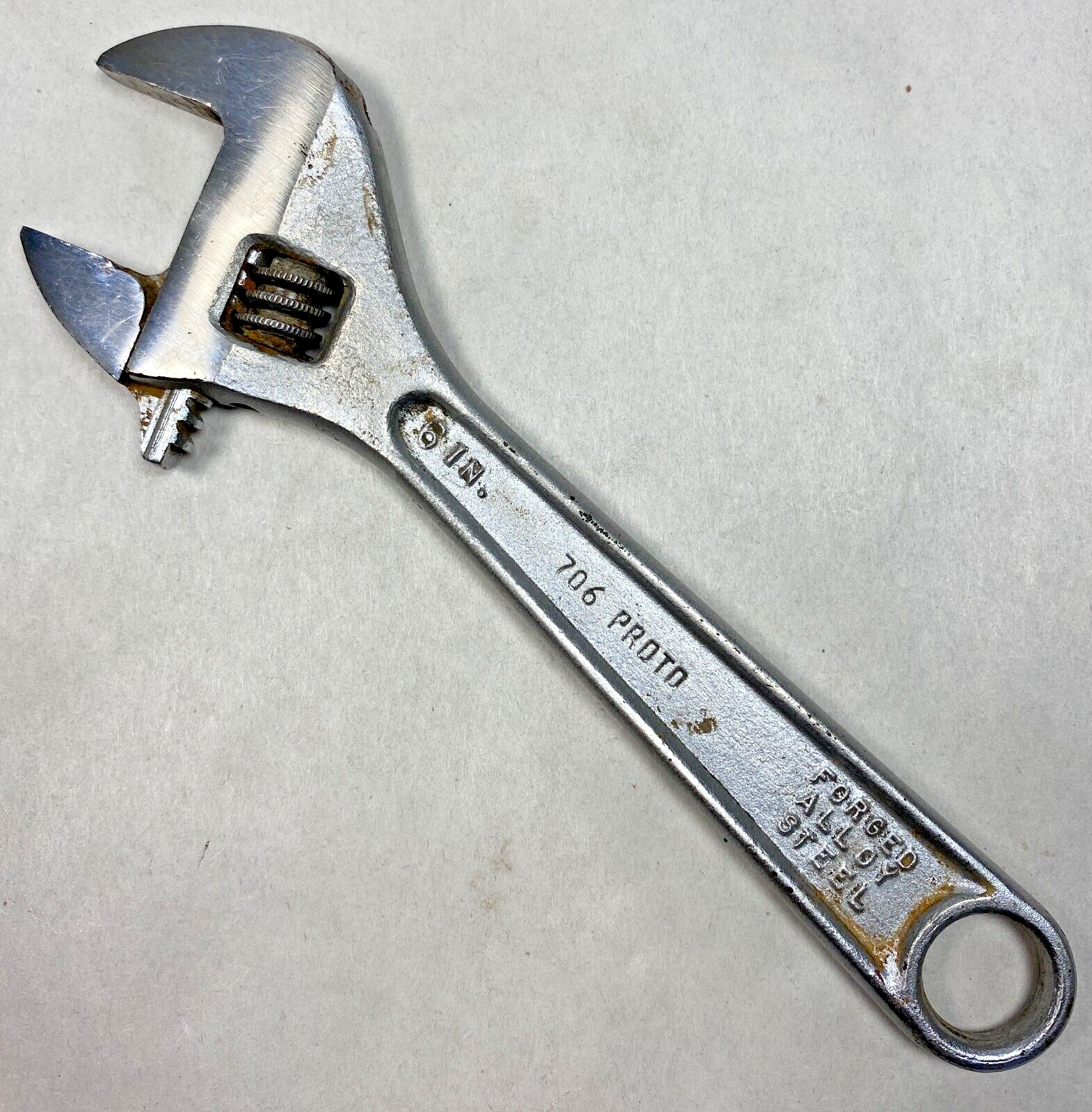 Chrome 6-inch adjustable crescent wrench with black handle, marked “706 PROD. FORGED ALLOY STEEL,” made in USA.