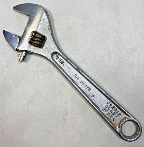 Chrome 6-inch adjustable crescent wrench with black handle, marked “706 PROD. FORGED ALLOY STEEL,” made in USA.