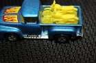 Vintage Hot Wheels 1973 metallic blue truck with yellow motorcycles in bed