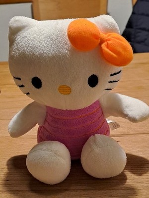 Hello Kitty in pinkem Anzug und oranger Schleife, 20x20x12 cm