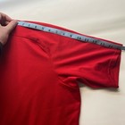 Red mesh Izumi men’s cycle shirt, small size, with front half-zip closure, made in Taiwan, measured on a light gray surface.