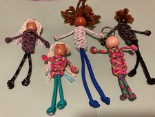 Glow-In-The-Dark paracord survival bracelets, keychains dolls are detachable.