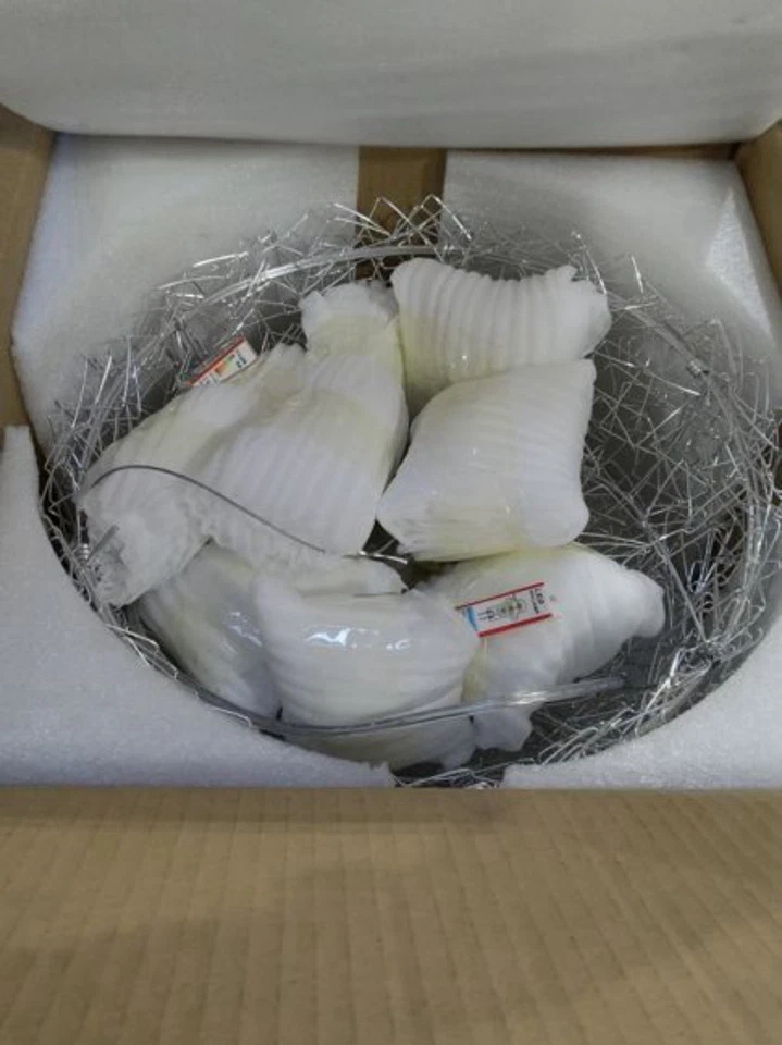 Elegante araña nido de pájaros de aluminio plateado muy única Foto 4 de 4