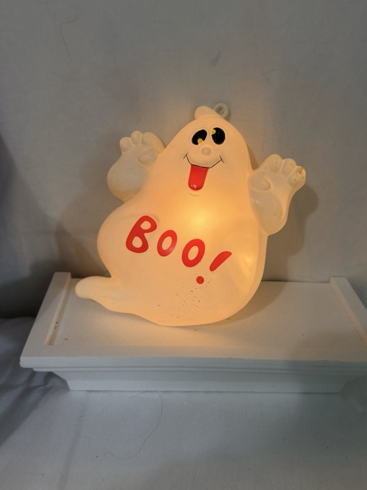 A working 1997 battery-operated Halloween ghost that blinks and winks — a genuine piece of late-90s holiday kitsch that still does its spooky little job.
