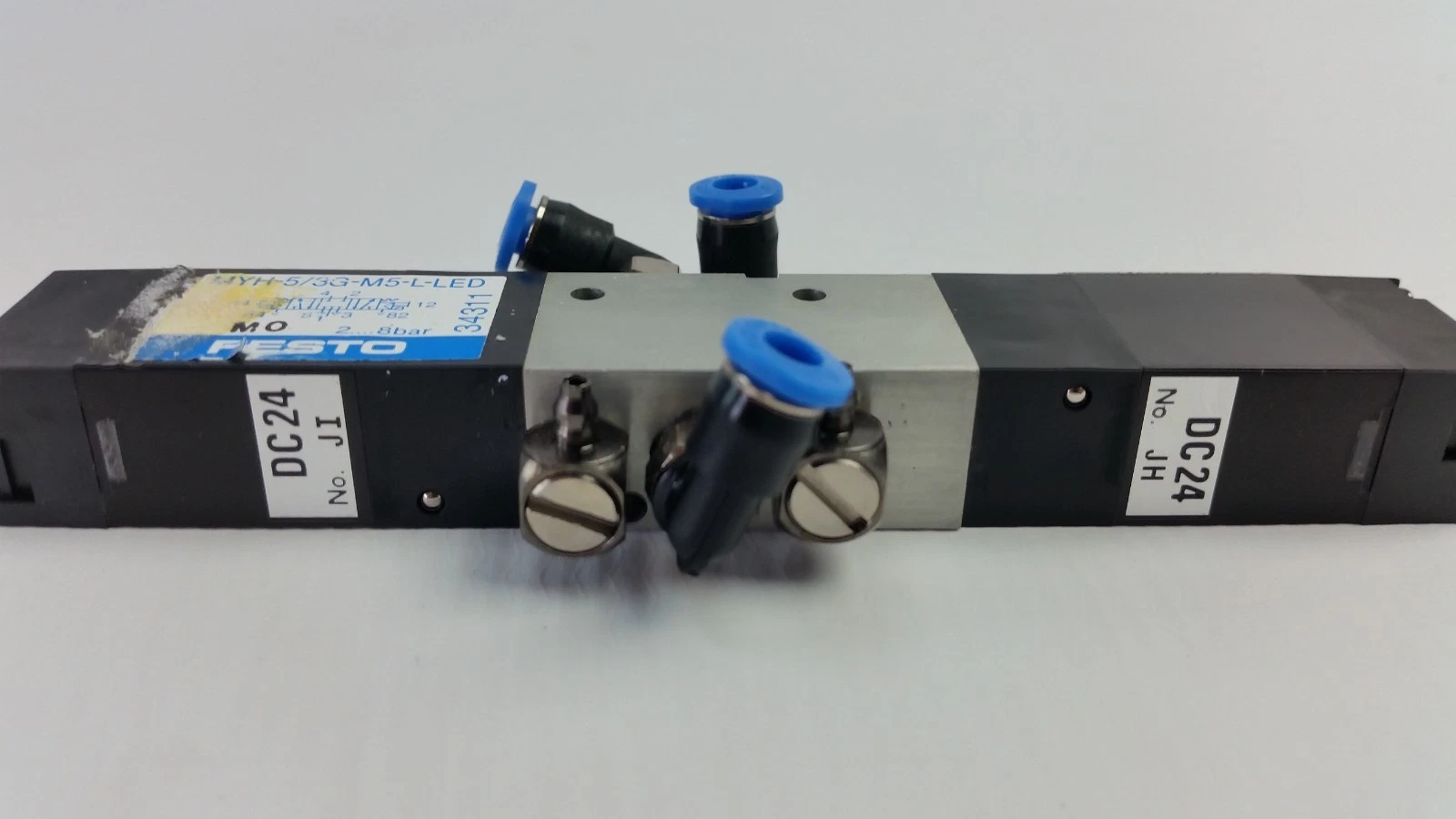 Festo MYH-5/3G-M5-L-LED valve showing DC24 coil ends and working-port fittings