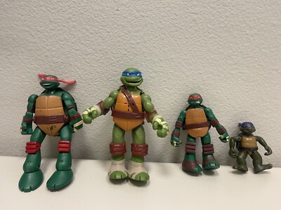 Lot of  4 Teenage Mutant Ninja Turtles Action Figures.