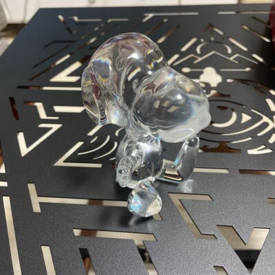 Baccarat Cystal snoopy sitting with right hand raised IN RED