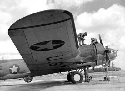 Ground staff servicing a flying fortress plane a US air-base so- 1942 Old Photo