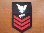 VINTAGE WW2 ERA US BLACK FELT PATCH WITH WHITE EAGLE AND BOMB & 3 RED STRIPES.