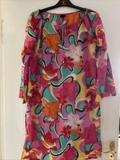 Summer Shirt Dress. Round neckline with lace-up fastening. Long sleeve. Slits o