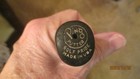 Black vintage Ping Anser putter head with “PING” logo, “Golf Pride Made in U.S.A.” text, and serial number 33.5 inches.