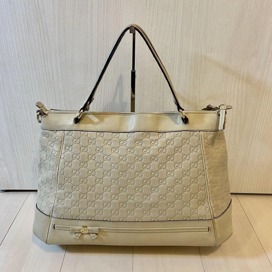Sac fourre tout GUCCI imbriqué motif GG cuir rayé ruban blanc