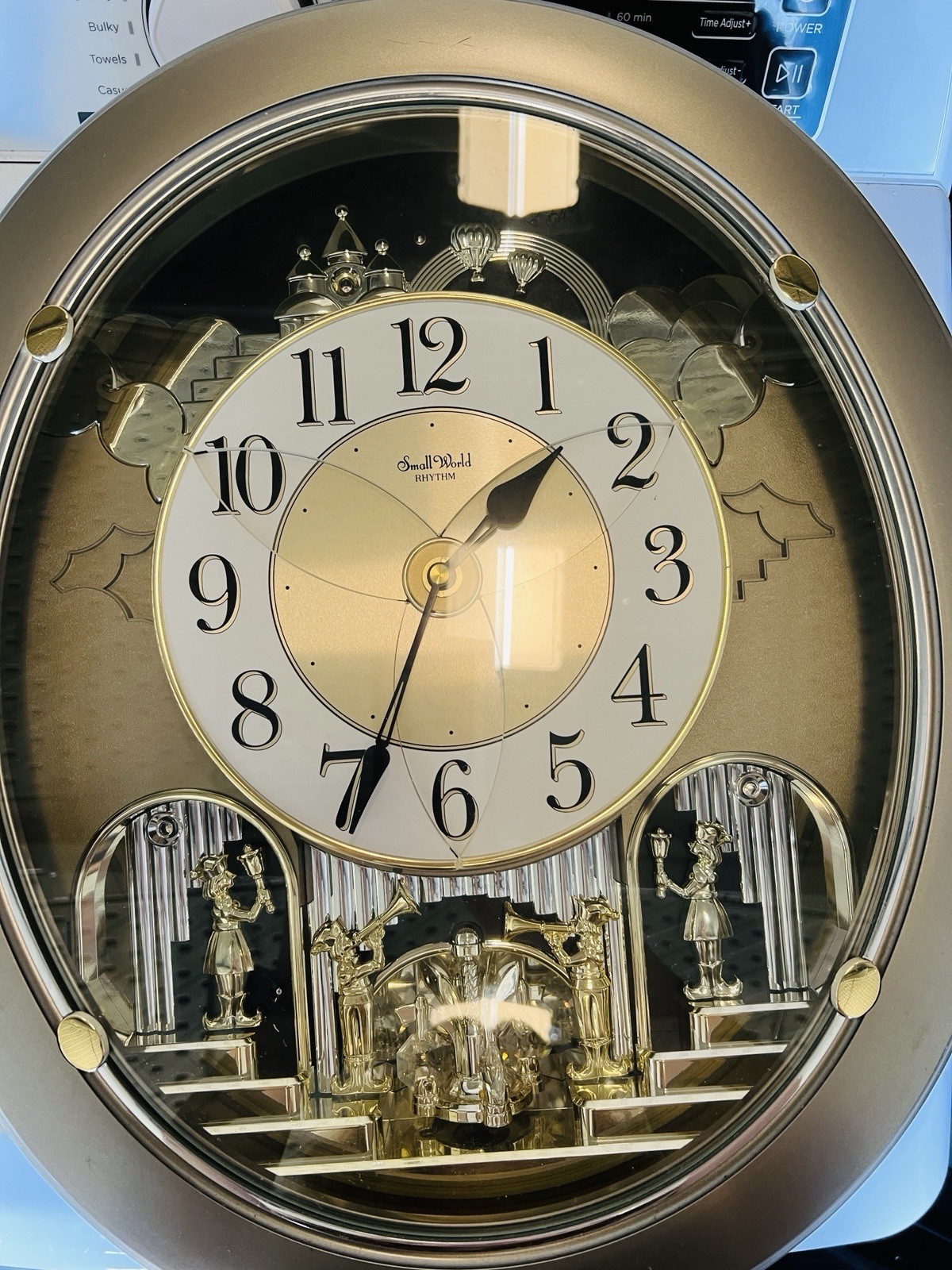 Rhythm Small World 4MH843 Musical Wall Clock Gold 12 Melodies Quartz Analog