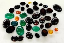 lot of 100 Carats of assorted loose gemstones varied sizes and shapes Cabochon
