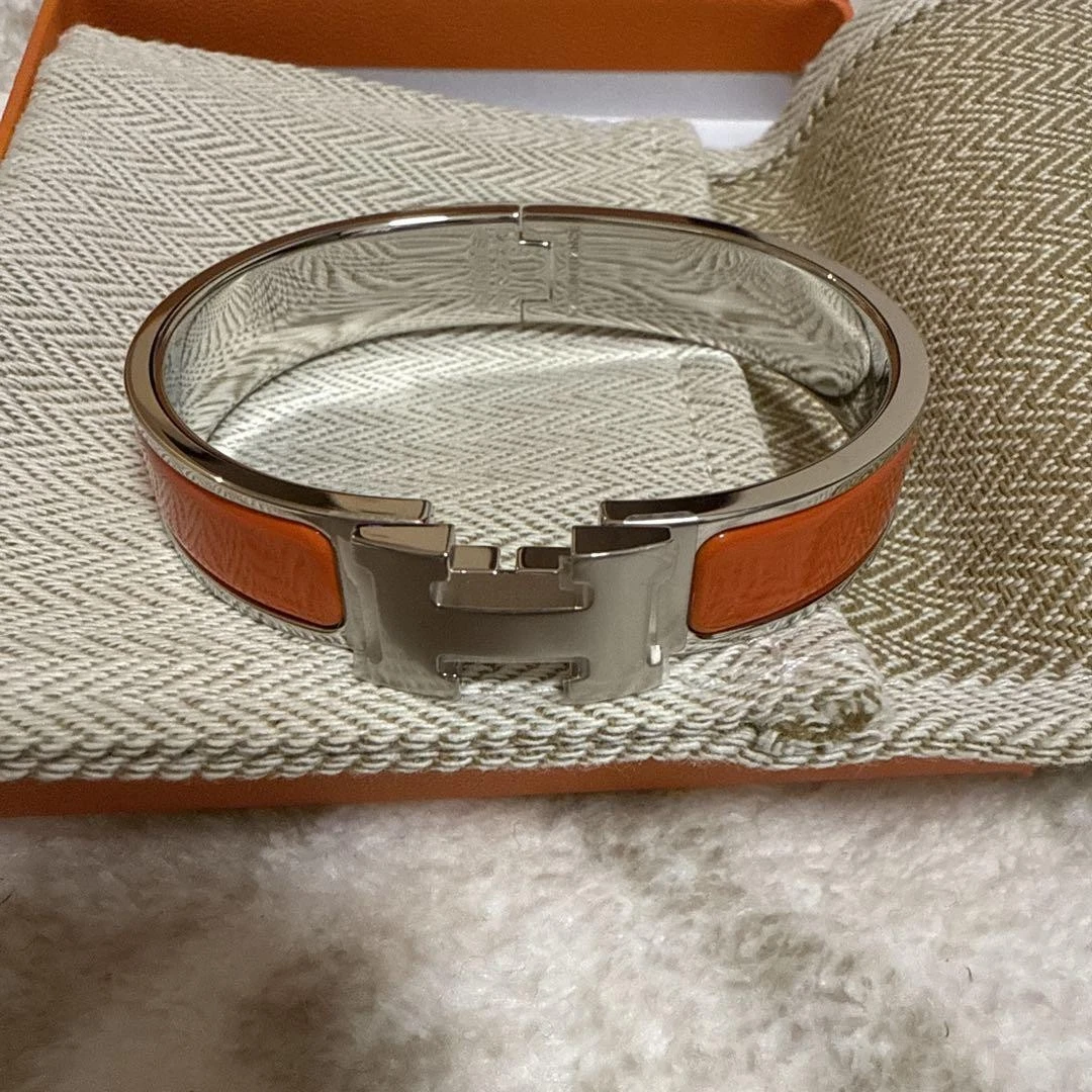 HERMÈS Bracciale aperto Hermes pelle arancione acciaio inox elegante gioiello