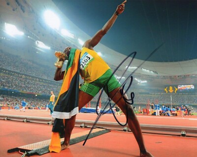 USAIN BOLT Signed 10X8 Photo WORLD CHAMPION SPRINTER  Athletics  COA