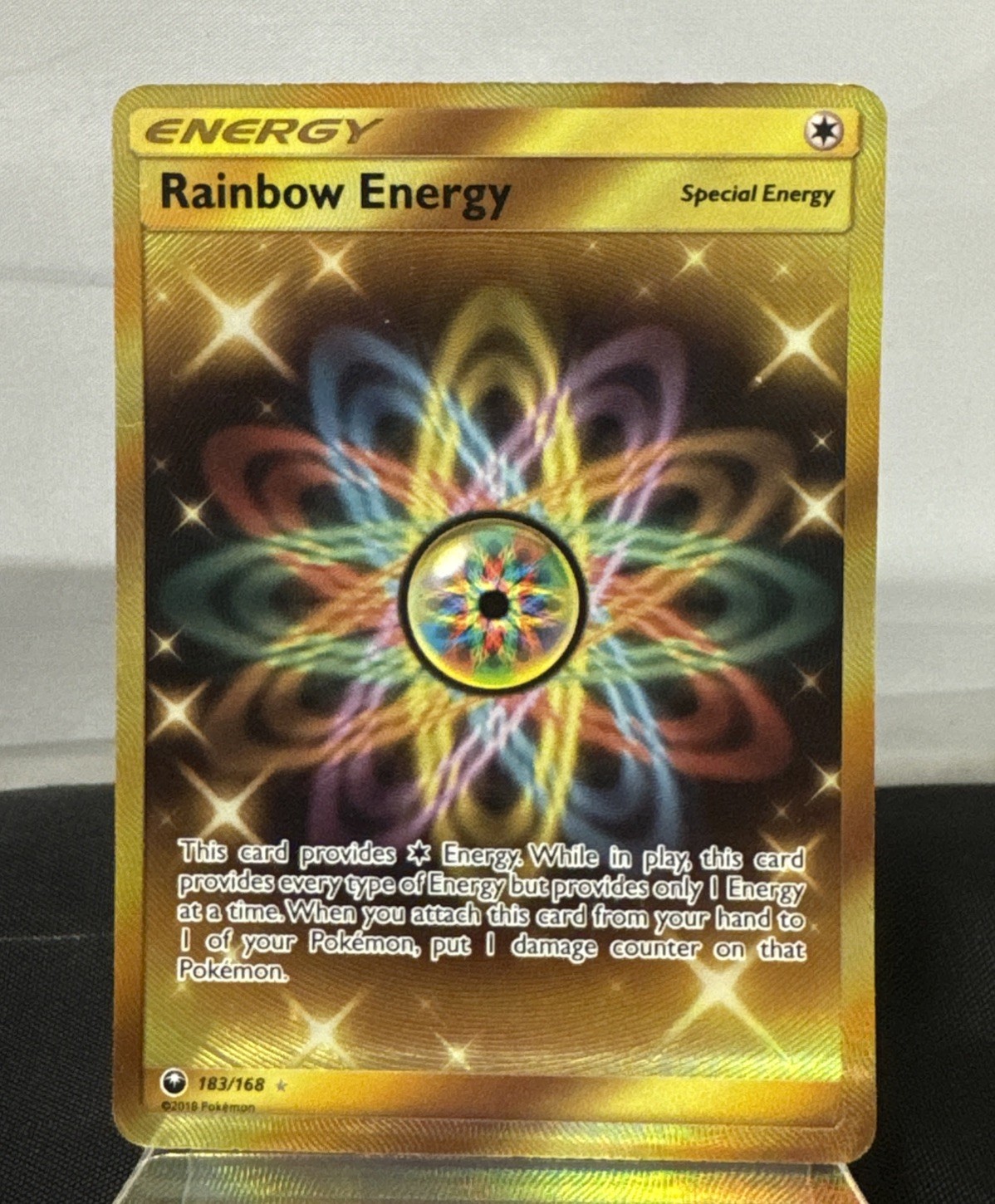 Pokemon 2018 Rainbow Energy - Sun & Moon Celestial Storm Rare Gold Holo 183/168
