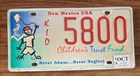 NEW MEXICO GRAPHIC SPECIALTY  LICENSE PLATE " KID 5800 " CHILDRENS TRUST FUND