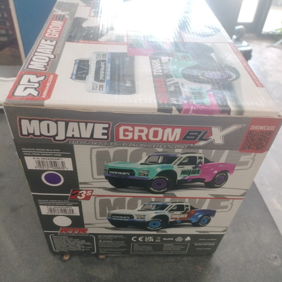 Camión ARRMA MOJAVE GROM 223S BLX sin escobillas 4X4 Desert RTR con batería/cargador verde azulado Foto 2 de 3