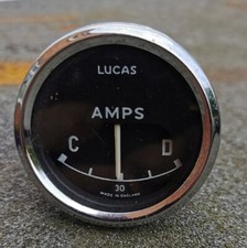 AMP  Guage Lucas Round Black Faced Chrome Beval Gauge