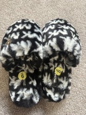 Michael Kors Lala or Janis faux fur slippers in a black and white print.