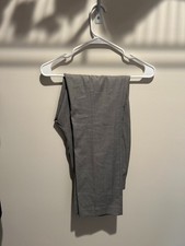 Grey Dress Pants: Mid-grey trousers with a subtle micro-textured weave for added