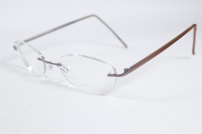 Marchon Brille 770 Unisex Braun 053 Randlos Metall Eyewear Brille Brillengestell