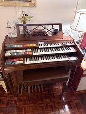 vintage Wurlitzer electric organ with bench