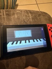 Nintendo Switch 32 Go Console avec Paire de Joy-Con - Bleu/Rouge