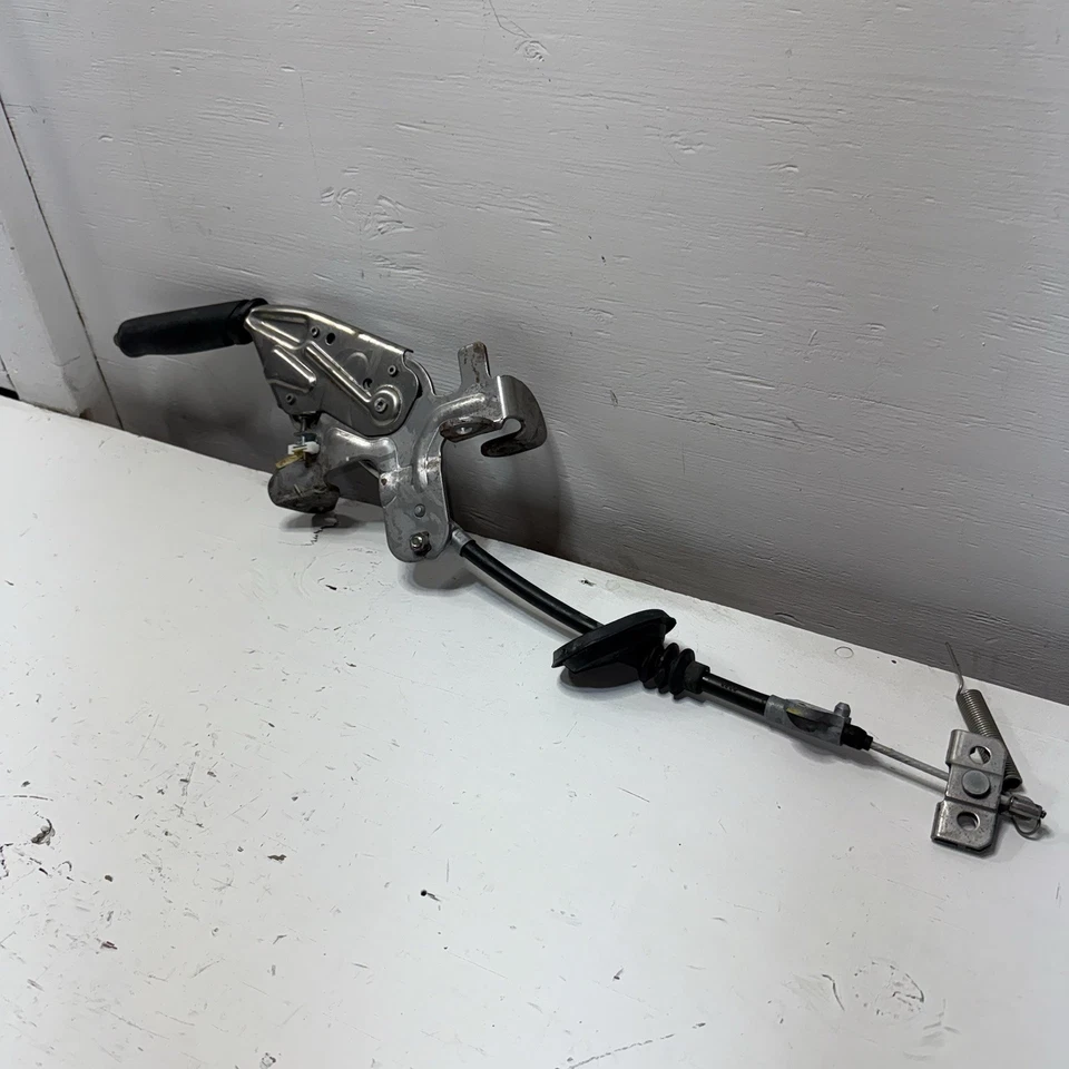 Nissan NV200 2013-2021 Chevrolet City manija de control de freno de estacionamiento con cable OEM Foto 2 de 4