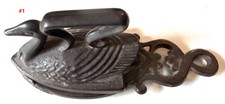 Antique sad iron  trivet SWAN and bonus sewing tape measure of coal iron