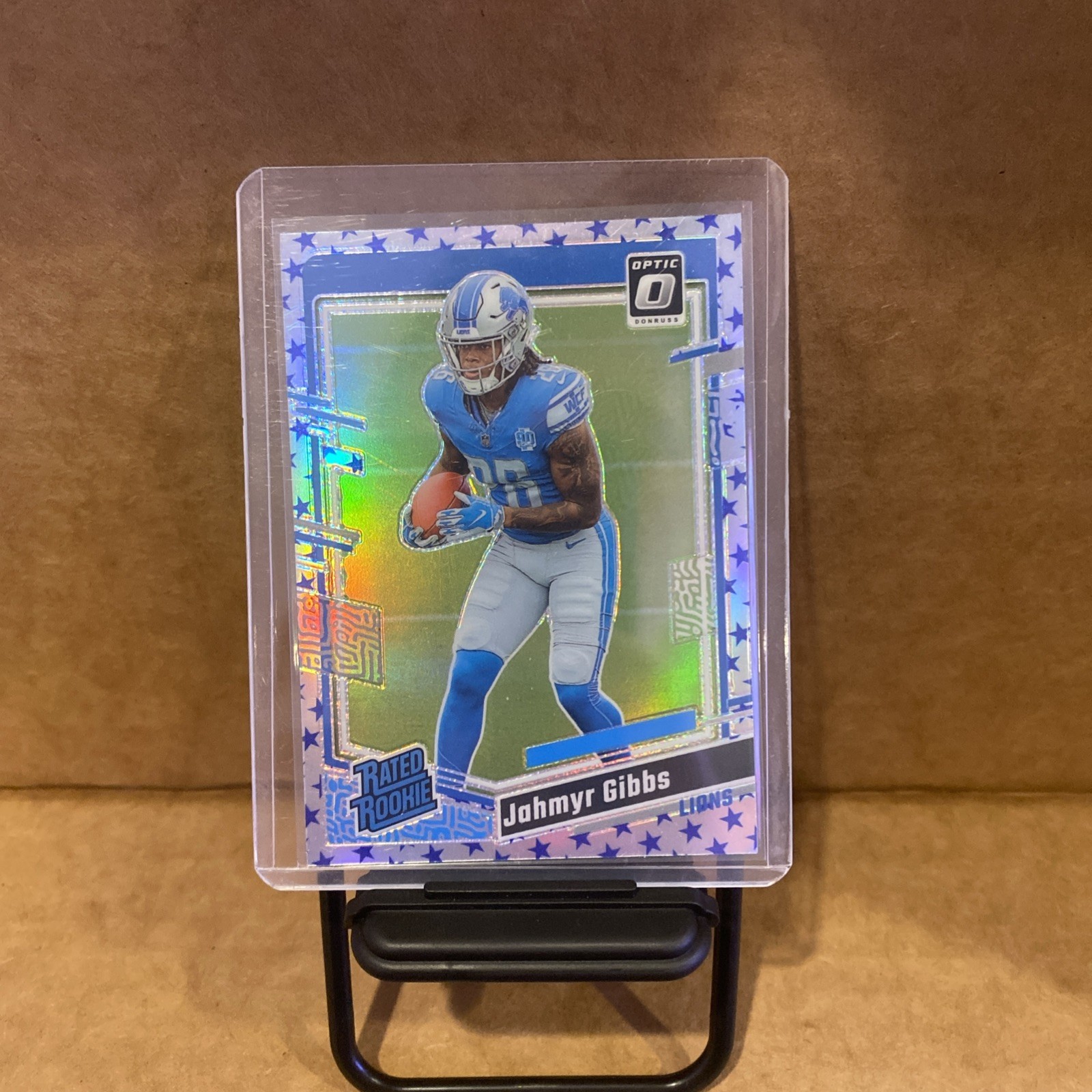 2023 Donruss Optic Jahmyr Gibbs Blue Stars Prizm Rated Rookie #236