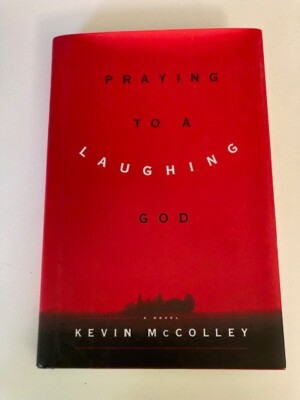 Praying to a Laughing God: A Novel by Kevin McColley (1998, HC) 1st Printing VG